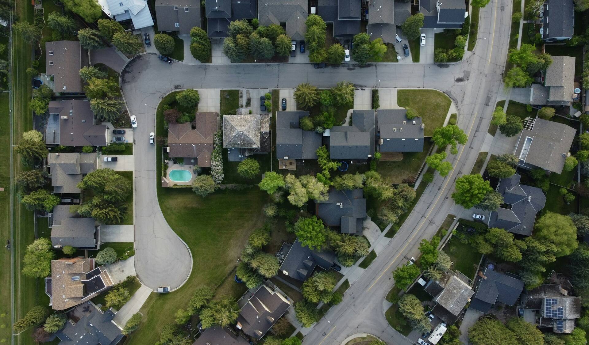 Aerial view of a suburban cul-de-sac showing individually mapped plots